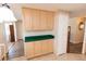Kitchen featuring wooden cabinets, white appliances, and a tile backsplash at 643 Blackburn Blvd, North Port, FL 34287