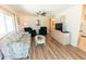 Spacious living room with comfortable seating, wood floors, and a television at 643 Blackburn Blvd, North Port, FL 34287