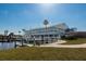 Beautiful waterfront building with boat docks on a sunny day, offering scenic views and access to the water at 643 Blackburn Blvd, North Port, FL 34287