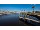 Picturesque waterfront view with boat docks and calm waters, offering a serene and relaxing atmosphere at 643 Blackburn Blvd, North Port, FL 34287