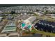Expansive aerial view shows the community pool and recreation area as well as the boat docks at 713 Riverview Cir, North Port, FL 34287