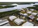 Aerial view of a waterfront neighborhood showcasing the home's location and surrounding landscape at 713 Riverview Cir, North Port, FL 34287
