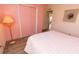 Comfortable bedroom featuring an ample closet, offers a serene atmosphere for rest and relaxation at 713 Riverview Cir, North Port, FL 34287