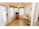 Cozy dining area featuring a table with chairs, ample natural light, and an exterior door at 713 Riverview Cir, North Port, FL 34287