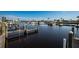 Waterfront docks for community boat access, featuring docks, pilings, and dark tranquil water at 713 Riverview Cir, North Port, FL 34287