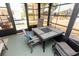 Lanai with a table, 4 chairs and outdoor views through screened windows at 713 Riverview Cir, North Port, FL 34287