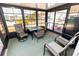 Bright and airy lanai featuring a table with 4 chairs with a view of the neighborhood at 713 Riverview Cir, North Port, FL 34287