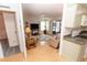 Light and airy living room featuring a ceiling fan, sliding glass doors, and laminate flooring at 713 Riverview Cir, North Port, FL 34287