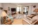 Comfortable living room featuring a ceiling fan, sliders to lanai, and light colored walls at 713 Riverview Cir, North Port, FL 34287