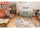 Bright living room with ceiling fan, complemented by comfortable seating, offers a perfect relaxing space at 713 Riverview Cir, North Port, FL 34287