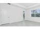 Bright, airy bedroom with an ensuite bath and large window at 8488 Saint Kitts Cir, Englewood, FL 34224