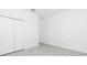 This bedroom features tiled floors, a closet, and neutral walls at 8488 Saint Kitts Cir, Englewood, FL 34224