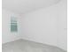 This room features a neutral paint, tiled floors and a view to the outside at 8488 Saint Kitts Cir, Englewood, FL 34224