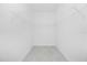 Empty closet with wire shelving and neutral-toned flooring at 8488 Saint Kitts Cir, Englewood, FL 34224