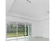 Living room with sliding glass doors leading to the outside at 8488 Saint Kitts Cir, Englewood, FL 34224