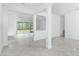 Open-concept living room with tile flooring at 8488 Saint Kitts Cir, Englewood, FL 34224