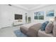 A stylishly decorated main bedroom featuring an en-suite bathroom and walk-in closet at 8488 Saint Kitts Cir, Englewood, FL 34224