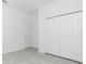 A white room featuring a closet with double doors and neutral-toned flooring at 8488 Saint Kitts Cir, Englewood, FL 34224