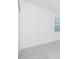 Tiled flooring in a neutral-toned room with window at 8488 Saint Kitts Cir, Englewood, FL 34224