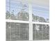 Window with a view of lush greenery at 8488 Saint Kitts Cir, Englewood, FL 34224