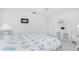 Comfortable bedroom featuring floral bedding, neutral decor, and bright, natural light at 910 Via Tripoli, Punta Gorda, FL 33950