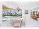 Eat-in kitchen dinette features a lovely pool view and natural light at 910 Via Tripoli, Punta Gorda, FL 33950
