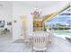 Eat-in kitchen dinette features a lovely pool view and natural light at 910 Via Tripoli, Punta Gorda, FL 33950