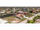 Beautiful waterfront home featuring lush landscaping, a private dock, and a screened-in pool area at 910 Via Tripoli, Punta Gorda, FL 33950