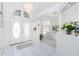 Bright foyer with double doors, tile flooring, columns, and open view to living space at 910 Via Tripoli, Punta Gorda, FL 33950