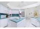 Kitchen featuring a center island, stainless appliances and tile countertops at 910 Via Tripoli, Punta Gorda, FL 33950
