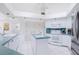 Spacious kitchen with white cabinets, tile backsplash and modern appliances at 910 Via Tripoli, Punta Gorda, FL 33950