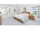 Spacious main bedroom with ensuite bathroom, neutral decor, and ample natural light at 910 Via Tripoli, Punta Gorda, FL 33950