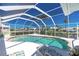 Clear-water screened pool featuring views of the waterway, pool steps and comfortable seating at 910 Via Tripoli, Punta Gorda, FL 33950