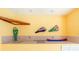 Bright yellow pool room featuring a functional wet bar and custom decor at 910 Via Tripoli, Punta Gorda, FL 33950