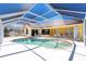 Heated pool and lanai with an enclosed screened cage at 910 Via Tripoli, Punta Gorda, FL 33950