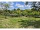 Spacious backyard featuring a secure black fence, offering privacy and a peaceful outdoor space at 10068 Winding River Rd, Punta Gorda, FL 33950
