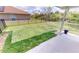 Well-maintained backyard with lush green lawn and secure black metal fencing, providing privacy at 10068 Winding River Rd, Punta Gorda, FL 33950