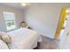 Cozy bedroom features a ceiling fan, neutral decor and ensuite bathroom at 10068 Winding River Rd, Punta Gorda, FL 33950