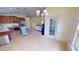 Open-concept kitchen flowing into living area, showcasing granite countertops and stainless steel appliances at 10068 Winding River Rd, Punta Gorda, FL 33950