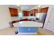 Modern kitchen with granite countertops, stainless steel appliances, and stylish center island at 10068 Winding River Rd, Punta Gorda, FL 33950