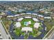 Stunning aerial view of waterfront condos, showcasing a community pool, lush landscaping, and boating access at 1080 Bal Harbor Blvd # 11C, Punta Gorda, FL 33950
