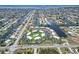 Aerial shot highlighting condo community's waterfront location, landscaped grounds, pool, and proximity to surrounding waterways at 1080 Bal Harbor Blvd # 11C, Punta Gorda, FL 33950
