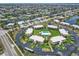 Aerial view of condos surrounded by landscaping and waterfront canals at 1080 Bal Harbor Blvd # 11C, Punta Gorda, FL 33950