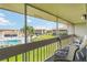 Relaxing balcony view overlooking the pool and lush landscaping at 1080 Bal Harbor Blvd # 11C, Punta Gorda, FL 33950