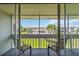 Serene balcony view showcasing the community pool and surrounding buildings at 1080 Bal Harbor Blvd # 11C, Punta Gorda, FL 33950