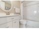 Bright, white bathroom featuring tile flooring, a vanity, and a shower-tub combo at 1080 Bal Harbor Blvd # 11C, Punta Gorda, FL 33950