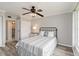 This bright bedroom features a ceiling fan, a bed, and a closet at 1080 Bal Harbor Blvd # 11C, Punta Gorda, FL 33950