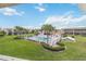 Inviting community pool surrounded by well-maintained green spaces and lounge chairs at 1080 Bal Harbor Blvd # 11C, Punta Gorda, FL 33950
