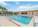 Outdoor swimming pool, surrounded by seating and lush landscaping at 1080 Bal Harbor Blvd # 11C, Punta Gorda, FL 33950