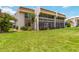 Well-maintained condo with screened-in patios and lush green lawn at 1080 Bal Harbor Blvd # 11C, Punta Gorda, FL 33950